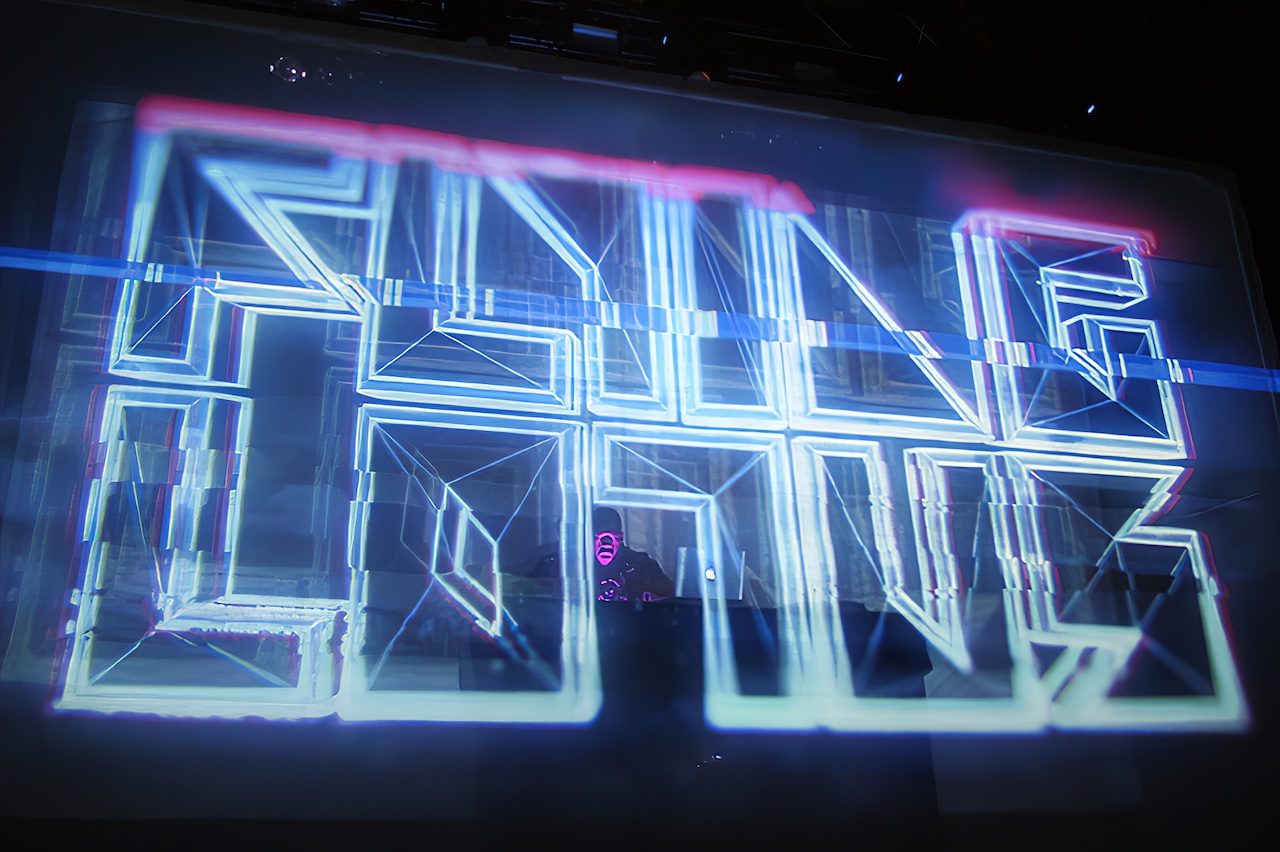 Flying Lotus, projection-mapped logo wireframe in neon